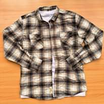A picture of Original flannel shirts available Call whatsapp 0759636169 Inbox for orders