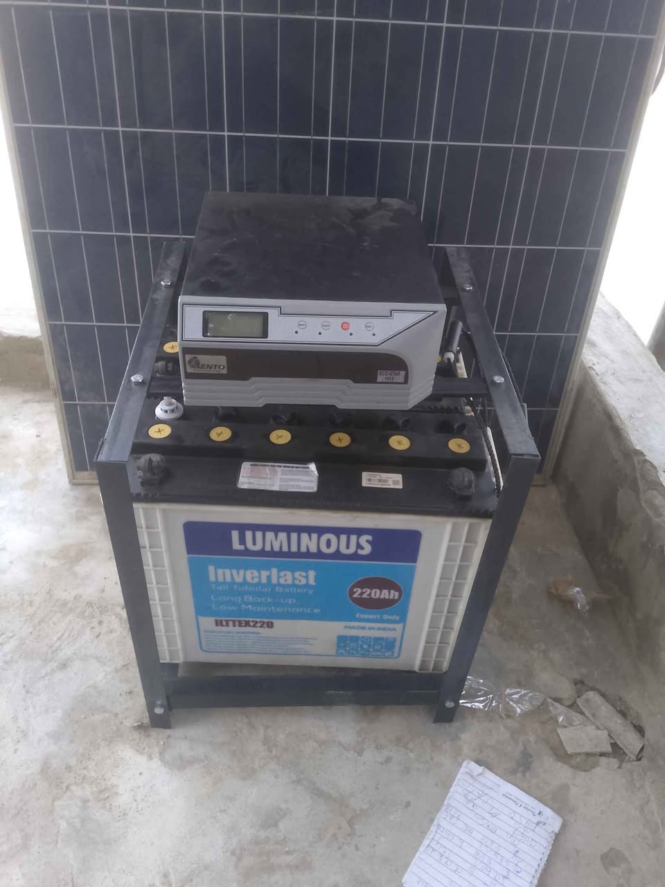 A picture of 1 4kva 12v with 2 batteries and 2 panels