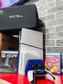 A picture of Sony PS5 slim version combo with 2controllers 2games FIFA and