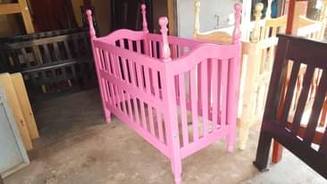 A picture of Baby crib in pink