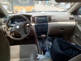A picture of Toyota Corolla LE Tok standard first body year 2004 nothing