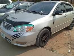 A picture of 2005 Corolla with android screen with pano roof buy and