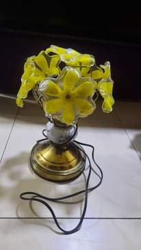 A picture of highchair lamp n cupboard