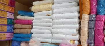 A picture of Purecotton towels in different sizes and colours it s a