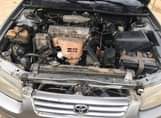 A picture of Registered 2000 Toyota Camry. Body need work.