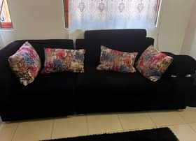 A picture of 3 seaters sofa and puff