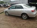A picture of very dope 2010 toyota corolla neatly flashed engine very mint