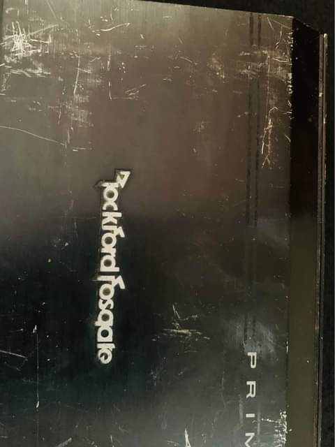 A picture of Rockford fosgate amplifier with jbl subwoofer