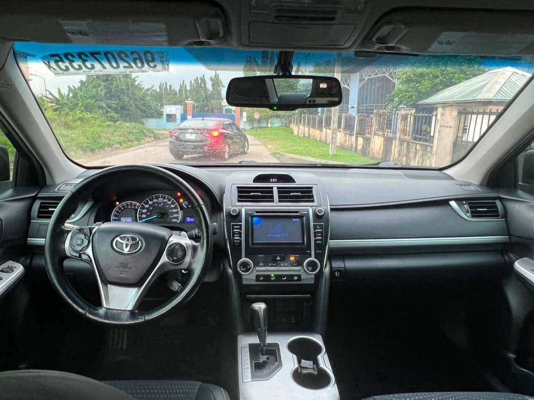 A picture of Distress Neatly Used 2013 Toyota Camry LE Untempered engine and