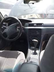 A picture of Toyota Camry tiny light Sound engine AC needs gas Gear
