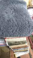 A picture of Fluffy and door mats 50 000 0705394267