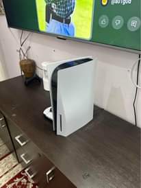 A picture of PS5 Gamepad and Skyworth TV 65 inch