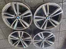 A picture of 19 ORIGINAL BMW MAGS WIDE AND NARROW. MAGS ARE IN