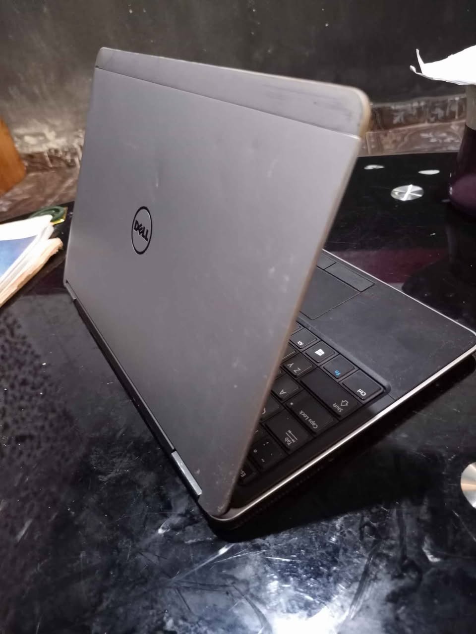 A picture of Dell laptop with SSD needs servicing 