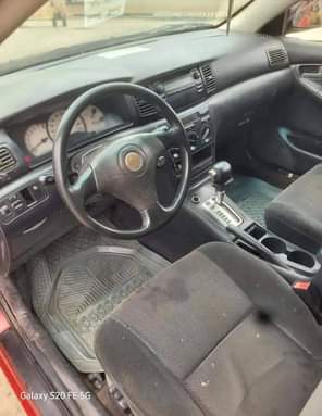 A picture of Toyota Corolla 2004 Engine tapping little Gear and AC ok