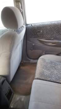 A picture of Mazda 323 still working well Owner 700 last Settlement 50