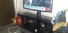 A picture of 43inch lg screen and tv stand with hoofer