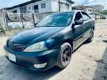A picture of Toyota Camry 2004 4 plug Engine gear and ac are