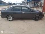 A picture of 2004 Corolla partly painted Urgent sale Everything working ok 1