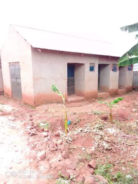A picture of 3 single rentals with a shop