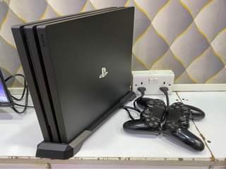 A picture of PS4pro 1tb storage uhd 4k with 5games on storage with