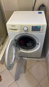 A picture of Washing machine storage printer and kids feeding chair water dispenser