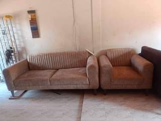 A picture of Four seaters fabric sofa set