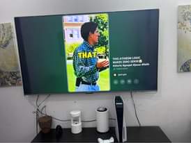 A picture of PS5 Gamepad and Skyworth TV 65 inch