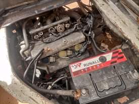 A picture of Tokunbo 3 plug engine serious manual back selts brand new