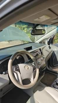 A picture of 2010 2011 Toyota Sienna Used by a woman in Abuja