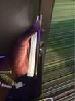 A picture of iPhone 11 Pro Max 256 with small covered crack at