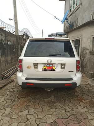 A picture of Sharp Honda pilot 2007 with a sound engine gear ac