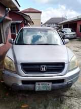 A picture of HONDA PILOT CAR HAS BEEN PARKED FOR LONG