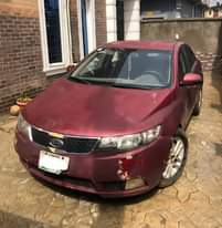 A picture of Nigerian Used Red Kia Cerato 2012 Repainted Automatic Fabric interior