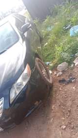A picture of Sharp 2006 toyota voltron with 4plugs engine black colour