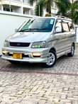 A picture of TOYOTA NOAH SR40 BEI MILLION 14 7