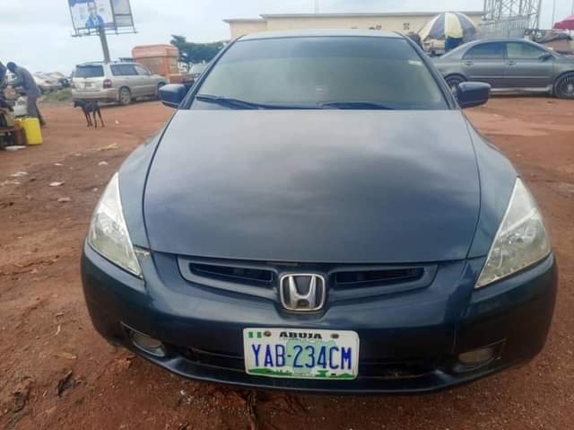 A picture of super clean 2004 model neatly painted Honda Accord with unterpered