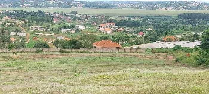 A picture of Sisa estate on sale with titles along hoima road Call