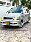 A picture of TOYOTA NOAH SR40 BEI MILLION 14 7