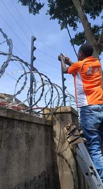A picture of CCTV satellite and electric fence installations