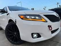 A picture of FOREIGN USED TOYOTA CAMRY 2011 Model Interior Clean 2023 headlight