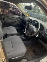A picture of Make TOYOTA Brand SUCCEED Year 2004 Color SLIVER GOLD Grade