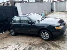A picture of toyota corolla model engine ac and gear and absolutely nothing