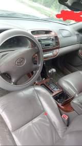 A picture of Toyota Camry firstbody. Engine gear and Ac . Clean in
