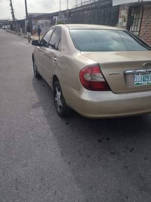 A picture of Toyota Camry Big daddy Color Gold Model 2003 Neatly Nigeria
