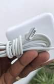A picture of Original used MacBook charger 85w. Available Wholesale and retail