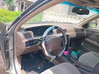 A picture of Super clean Toyota Camry 1999 Model. Tiny light 