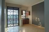 A picture of  Apartment Block For Sale Location Kyanja Kungu on tarmac.
