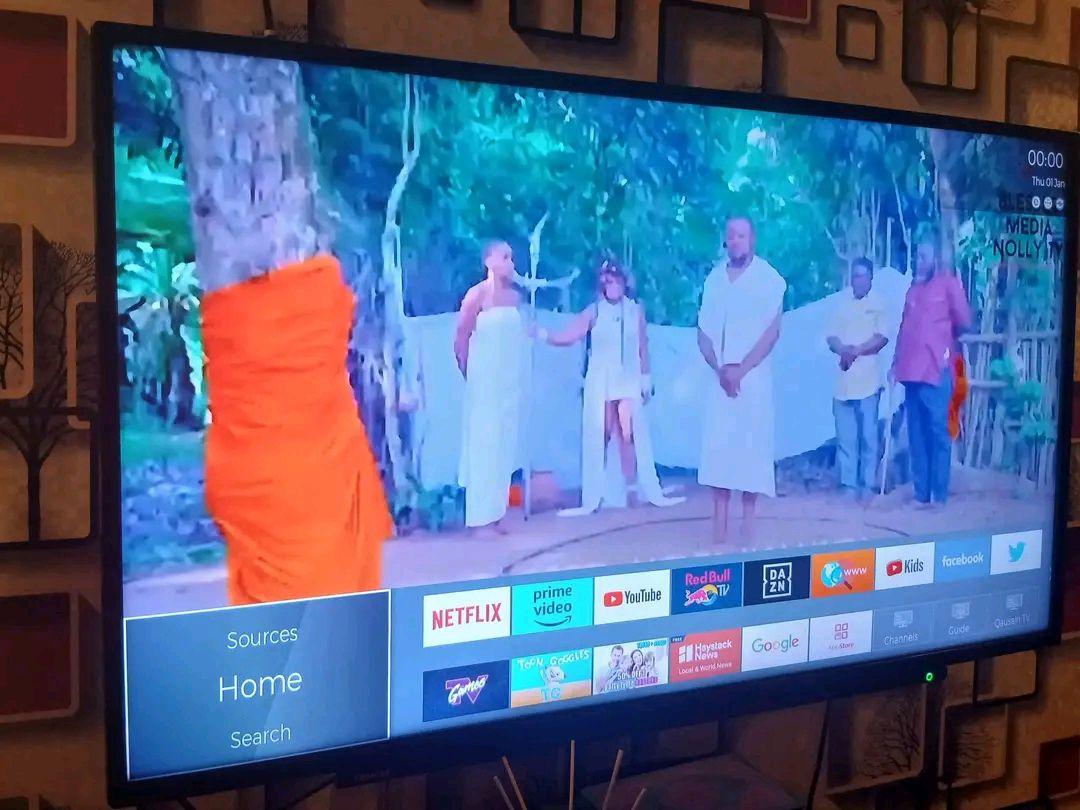 A picture of Washing machine and tv smart