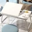A picture of Foldable and portable laptop desk or WhatsApp 0784884323